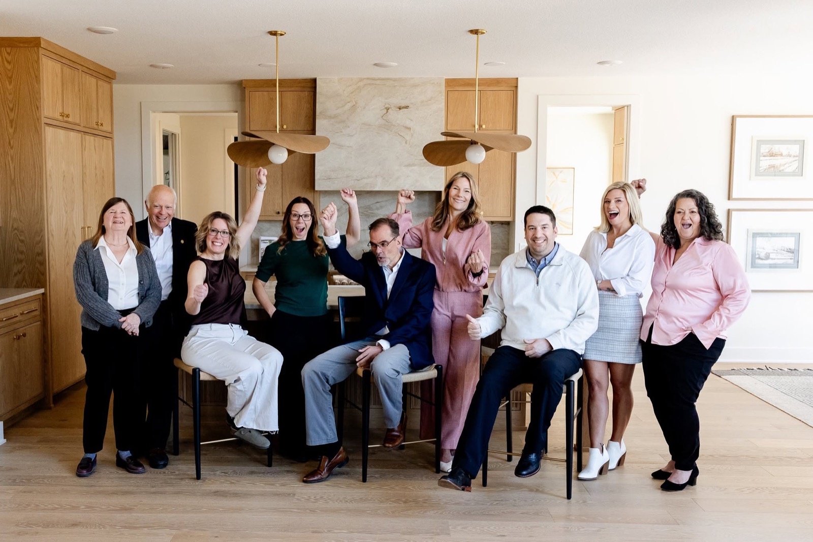 The Pinnacle Capital team celebrating in their office